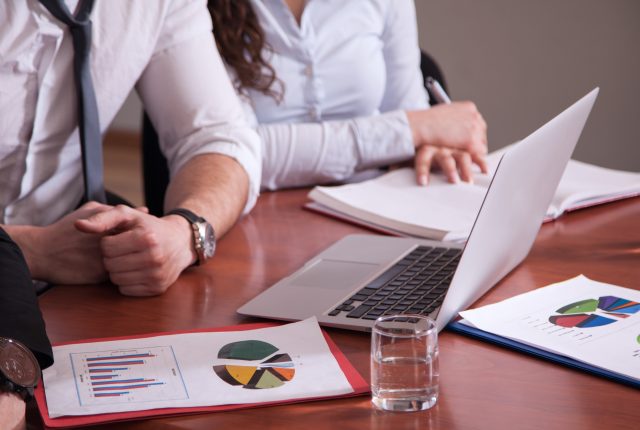 business partners discussing tax data