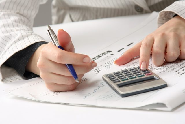 tax accountant preparing payroll and sales tax documents