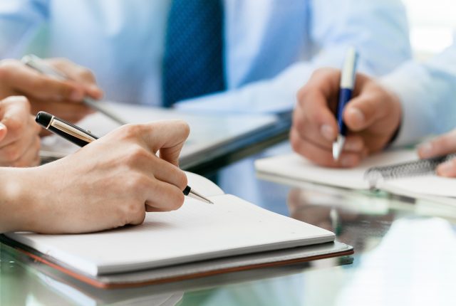 business consultants taking notes